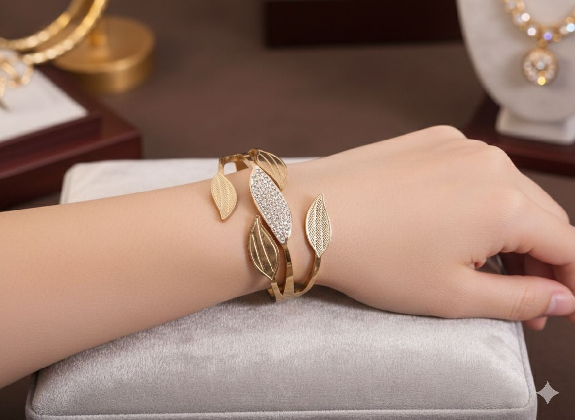 Gold leaf cuff bracelet with pavé crystal accents on wrist - jeevafashions