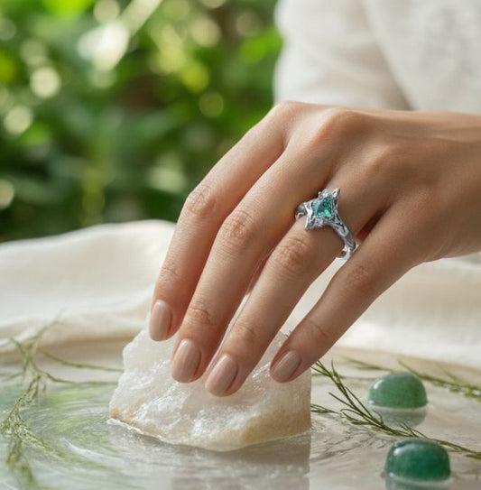 Hand-hammered silver ring with kite-shaped emerald close up JeevaFashions