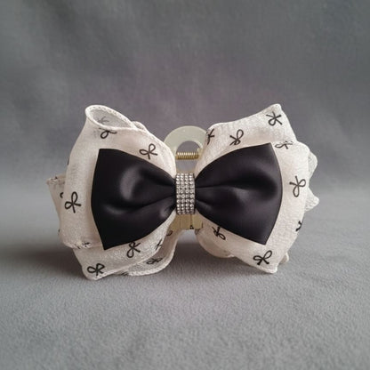 Dual-layer bow hair claw in beige organza and black satin with crystal centre for women – daily and festive wear