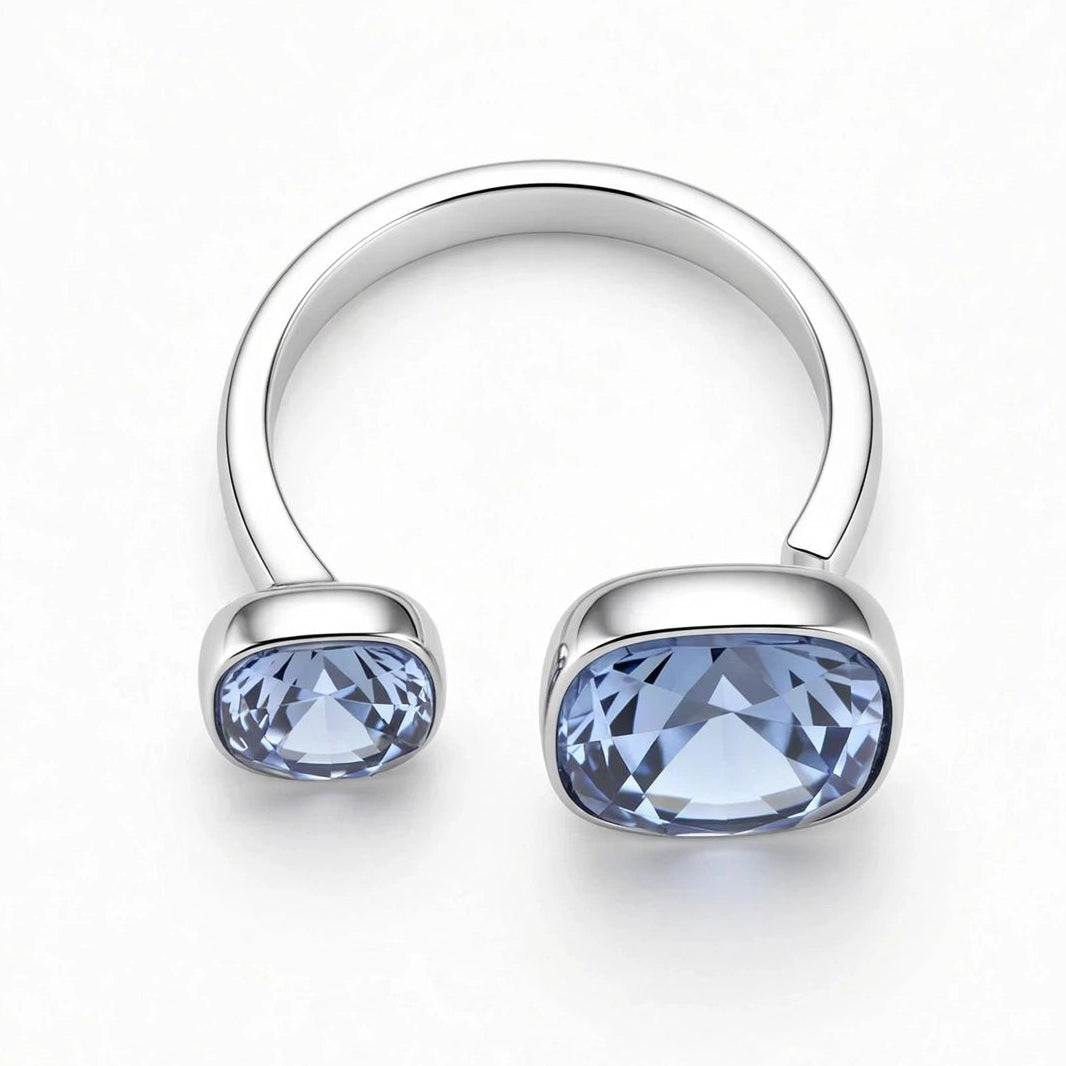 Blue crystal open ring closeup silver bezel setting for women at JeevaFashions