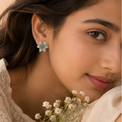 Gold tone blue white lily earrings closeup JeevaFashions