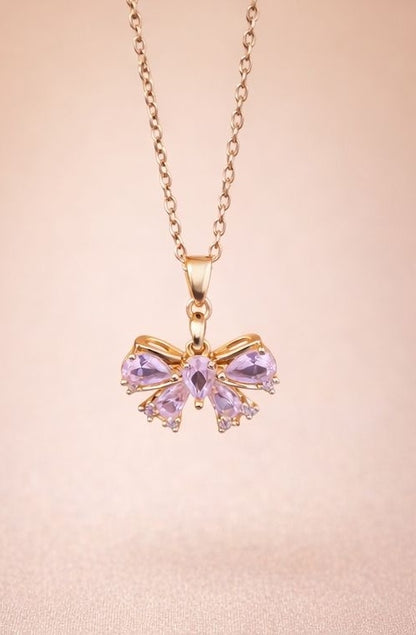 Bow pendant necklace set worn with Indian ethnic outfit