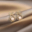 Bow pearl drop earrings gold tone crystal studded for women JeevaFashions
