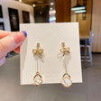 Bow pearl drop earrings elegant gold tone long dangle for women JeevaFashions