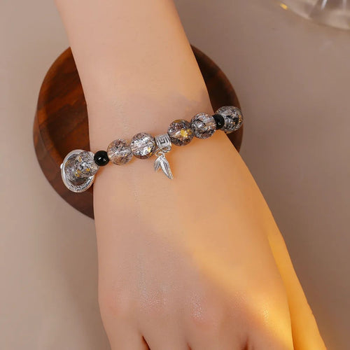 Hand-crafted celestial bead bracelet with silver charms JeevaFashions