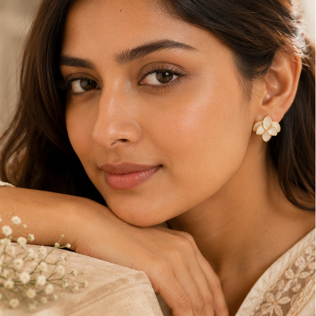Cream petal cluster earrings styled for festive occasion JeevaFashions