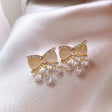 Crystal bow stud earrings with dangle drops – enamel rhinestone party wear earrings for Indian women – festive and wedding occasions