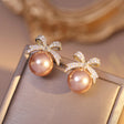 CZ bow peach pearl stud earrings gold tone for women JeevaFashions