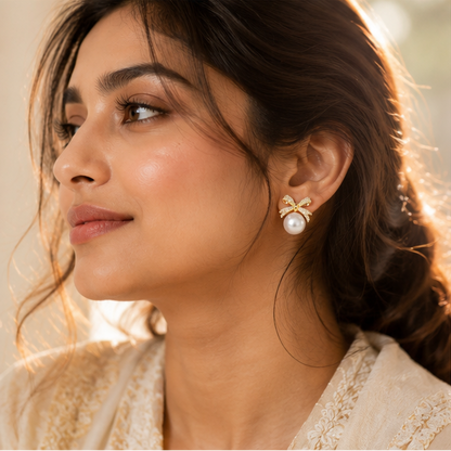 CZ bow pearl earrings styled for festive occasion JeevaFashions