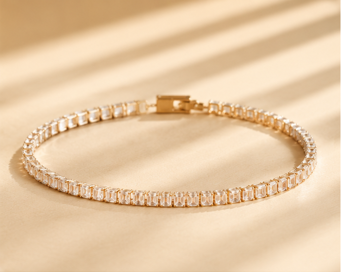 CZ tennis bracelet with rectangle stones in 18K gold plated stainless steel – flat lay on white background for women