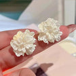 Elegant white floral stud earrings textured petal design JeevaFashions