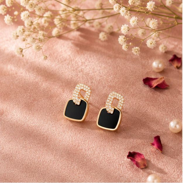 Pair of geometric black enamel gold stud earrings – lightweight push-back studs for office and casual wear