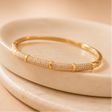 Geometric gold kada bracelet for women styled on wrist – bold cuff bangle for festive and daily wear