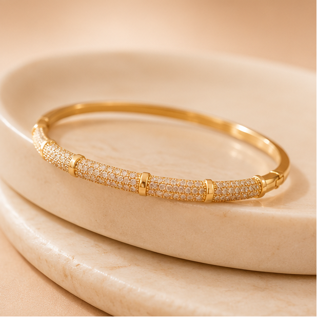 Geometric gold kada bracelet for women styled on wrist – bold cuff bangle for festive and daily wear