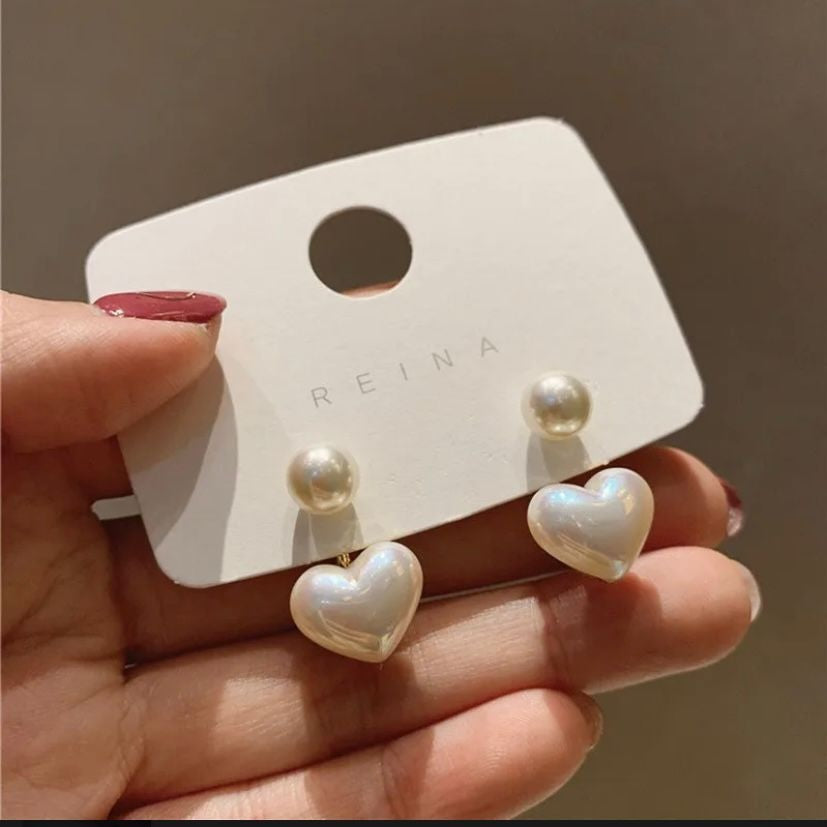 Glossy heart pearl charm earrings close up JeevaFashions