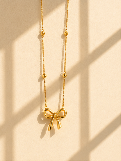 Gold plated bow shape pendant necklace for date night and festive occasions – anti-tarnish jewellery JeevaFashions