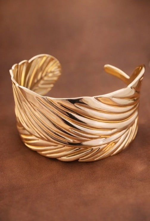 Statement gold feather open cuff bracelet for weddings and parties