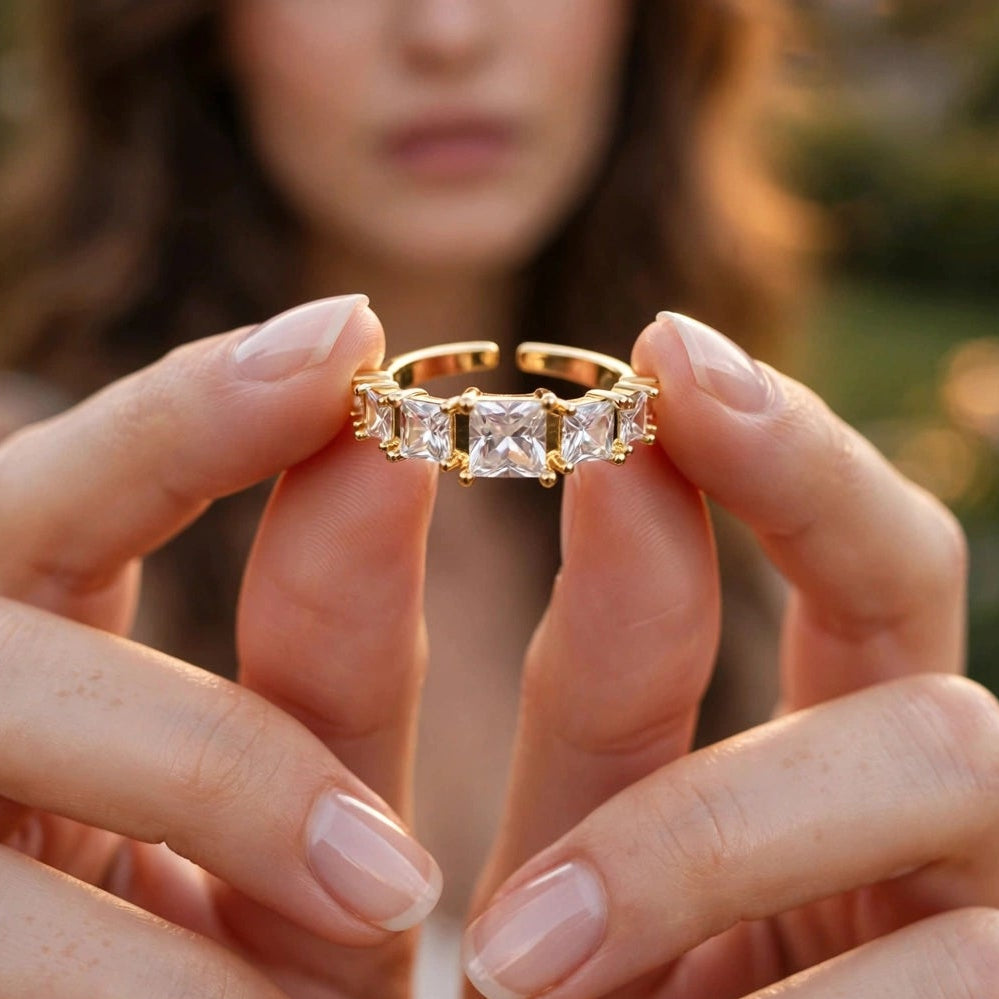 Close-up of prong-set graduated crystals on gold open ring for women at JeevaFashions