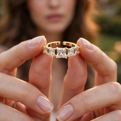 Close-up of prong-set graduated crystals on gold open ring for women at JeevaFashions