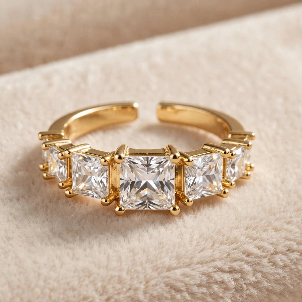 Graduated crystal open ring in gold stainless steel for women at JeevaFashions