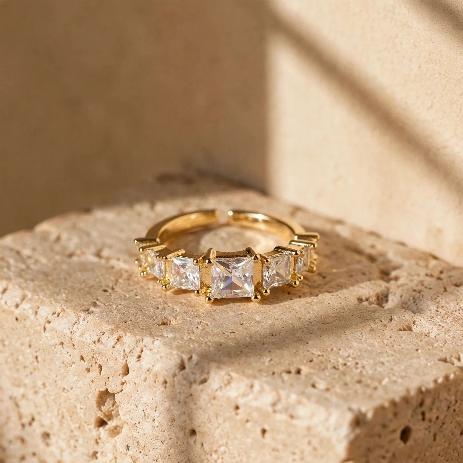 Side angle of gold graduated crystal open ring for women at JeevaFashions