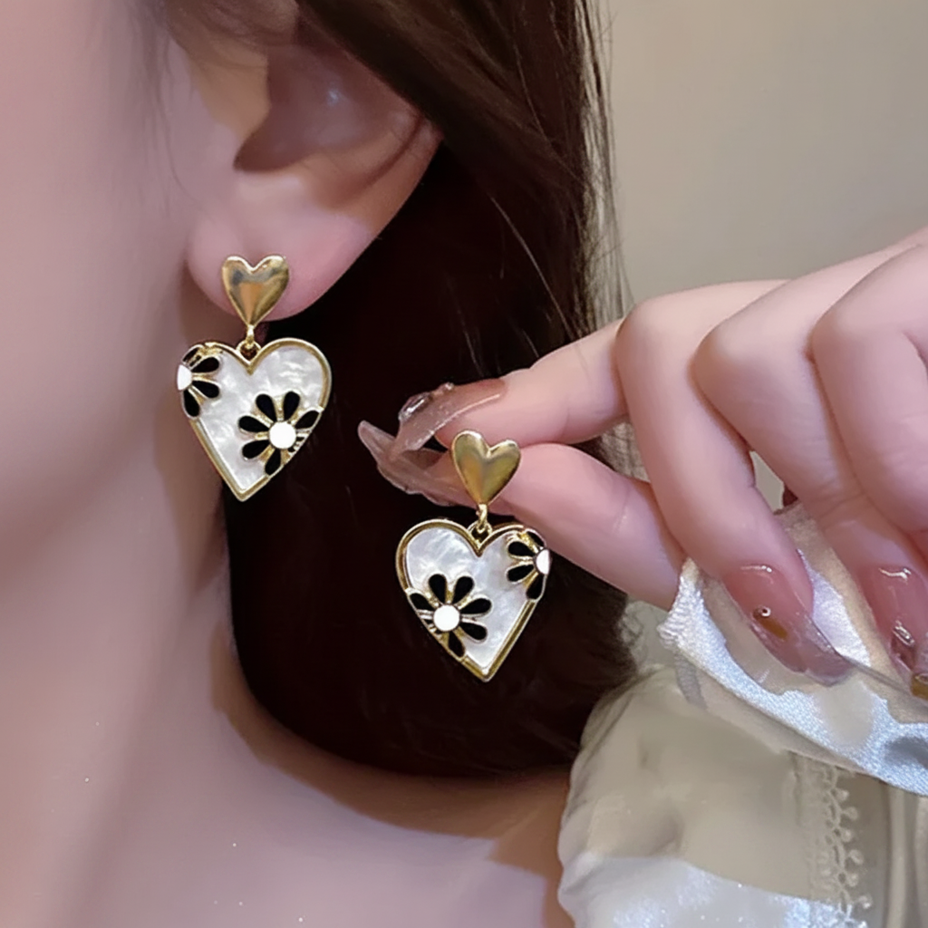 Gold heart drop earrings with floral charm for women JeevaFashions