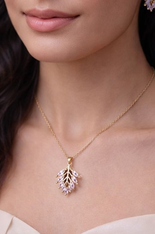 gold necklace pendant with leaf shaped closeup