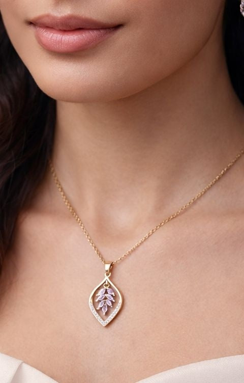 gold necklace with leaf-shaped pendant