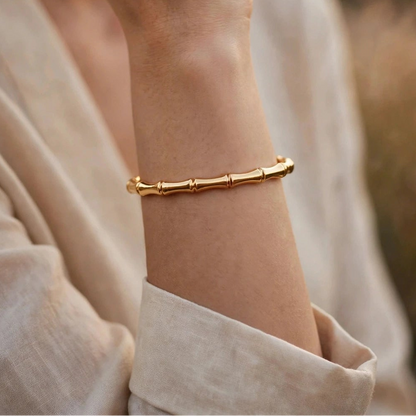 Close-up of segmented bamboo-joint pattern on gold open cuff bangle for women at JeevaFashions