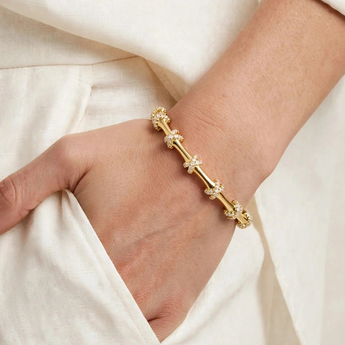 Open hinged clasp of pave X knot bangle bracelet for women at JeevaFashions