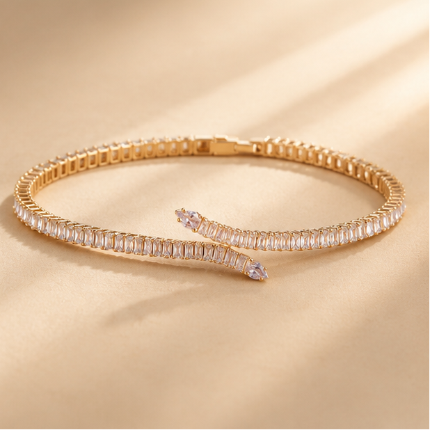 Gold plated baguette AD snake tennis bracelet flat lay – festive and party wear jewellery for women