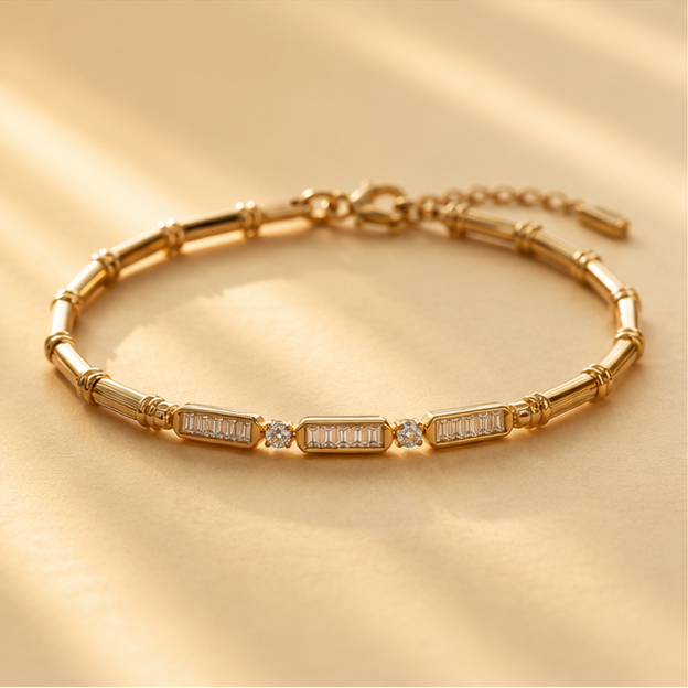 Flat lay of gold plated bamboo bracelet with glass stone accents – festive jewellery gift for women