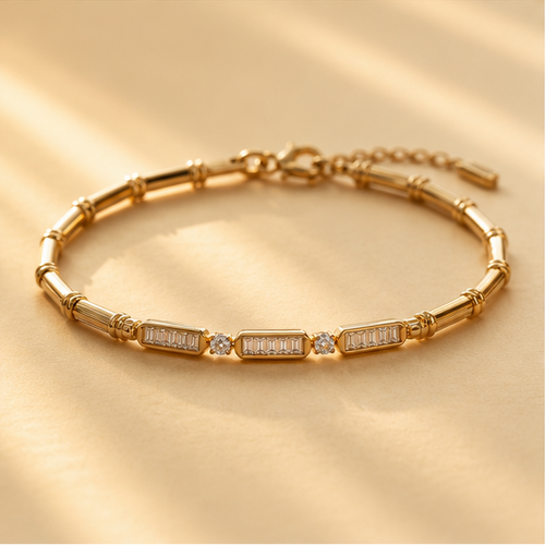Flat lay of gold plated bamboo bracelet with glass stone accents – festive jewellery gift for women