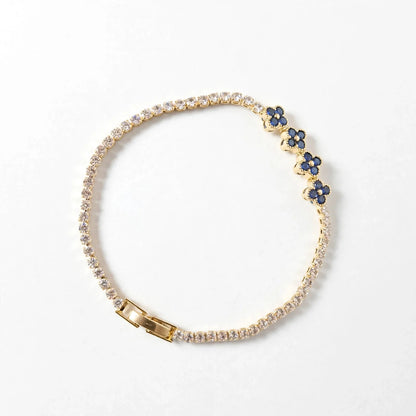 Blue clover CZ tennis bracelet gold plated flat lay for women JeevaFashions