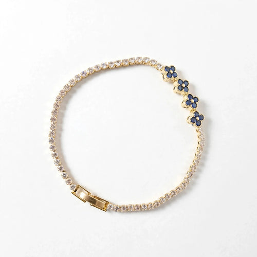 Blue clover CZ tennis bracelet gold plated flat lay for women JeevaFashions