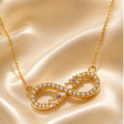 Gold plated infinity pendant necklace with round brilliant and baguette CZ stones for women – party and daily wear