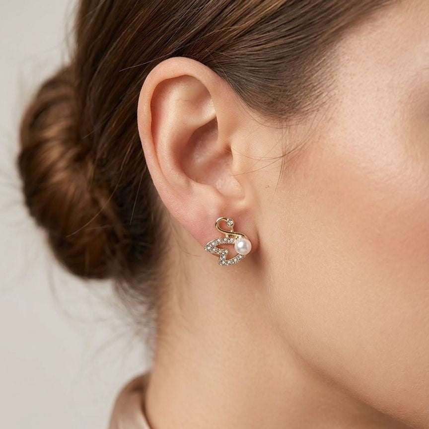 Gold plated swan earrings side view JeevaFashions