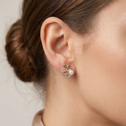 Gold plated swan earrings side view JeevaFashions