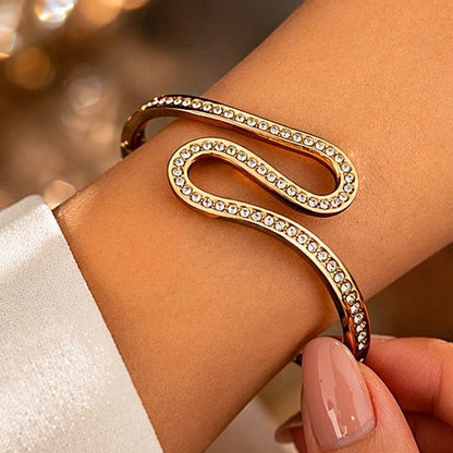 Gold S-shaped kada bracelet with CZ crystals close up JeevaFashions