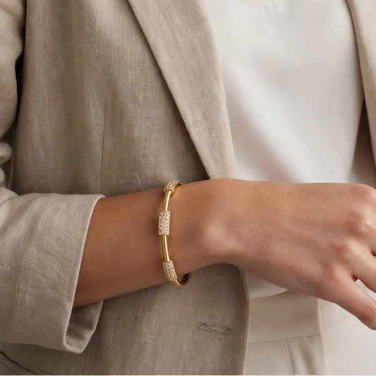 Close-up of bamboo joint design on gold plated stainless steel bangle for women at JeevaFashions