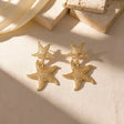 Gold starfish shell drop statement earrings for women – beach jewellery for vacations and summer events