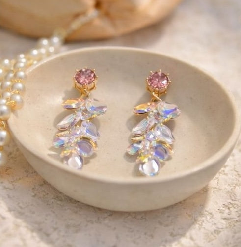 Gold tone crystal tassel drop earrings styled for Indian wedding and Diwali festive wear – rainbow iridescent glass stones