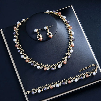 Gold tone pearl earrings and bracelet festive wear for women at JeevaFashions
