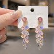 Gold tone rainbow crystal cascade drop earrings with iridescent glass waterdrops for women – party and festive wear