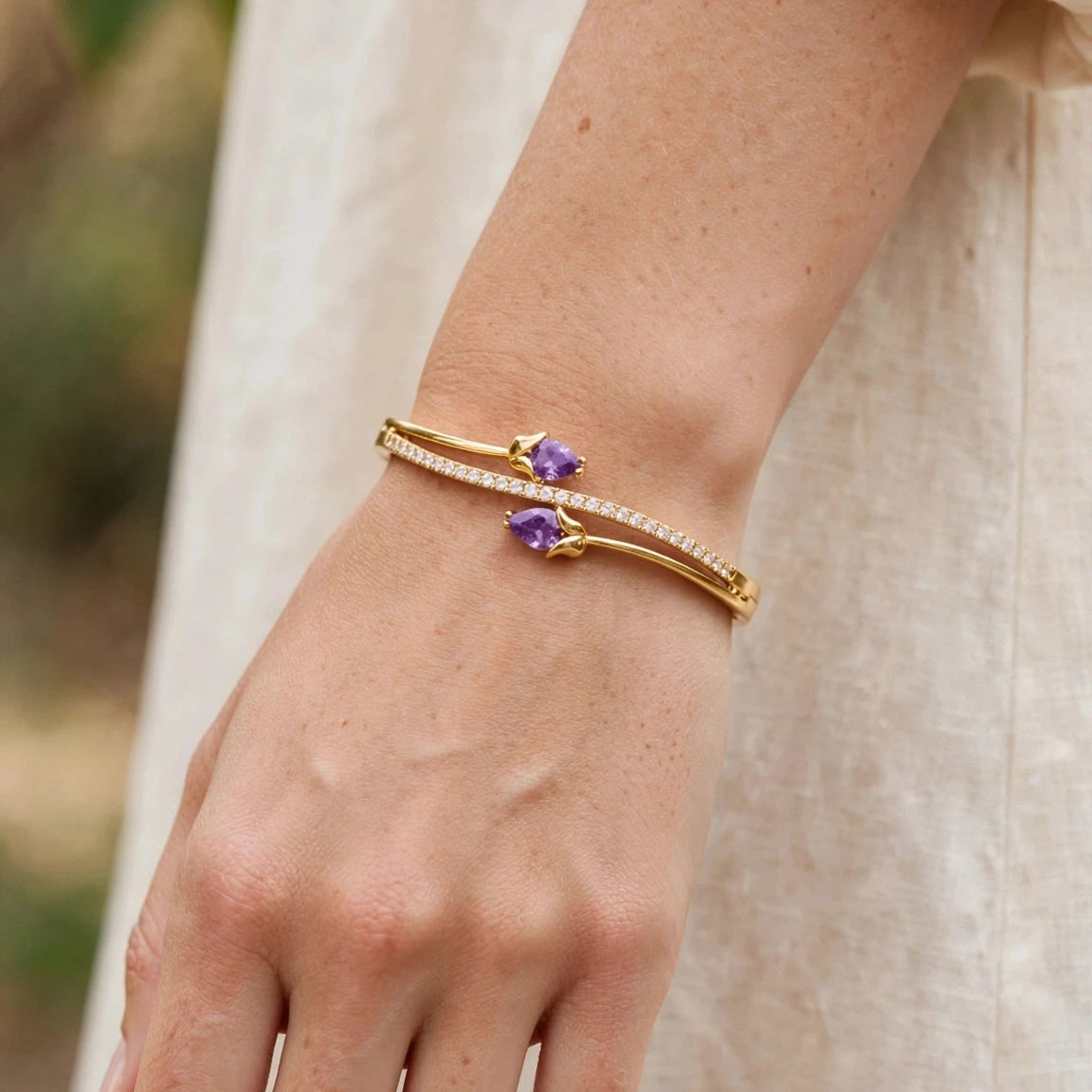 Gold tulip kada bracelet styled on wrist for women at JeevaFashions