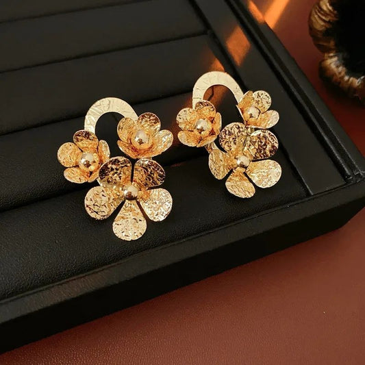 Golden bloom hammered texture floral stud earrings JeevaFashions