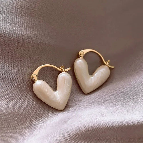 Heart huggie earrings with iridescent pearl resin and gold tone hoop – lightweight click-lock daily wear earrings for women
