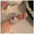 Iridescent pearl pave crystal interlocking heart stud earrings JeevaFashions