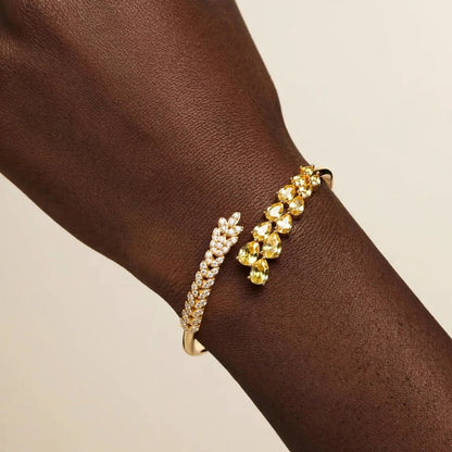 Leaf vine bangle bracelet angle view gold open cuff for women at JeevaFashions