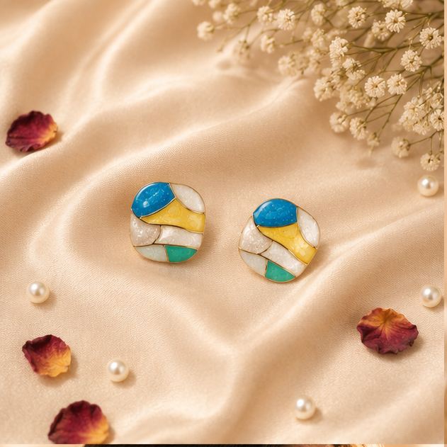 Close-up of abstract mosaic enamel stud earrings showing vibrant teal pink yellow and blue enamel panels – JeevaFashions